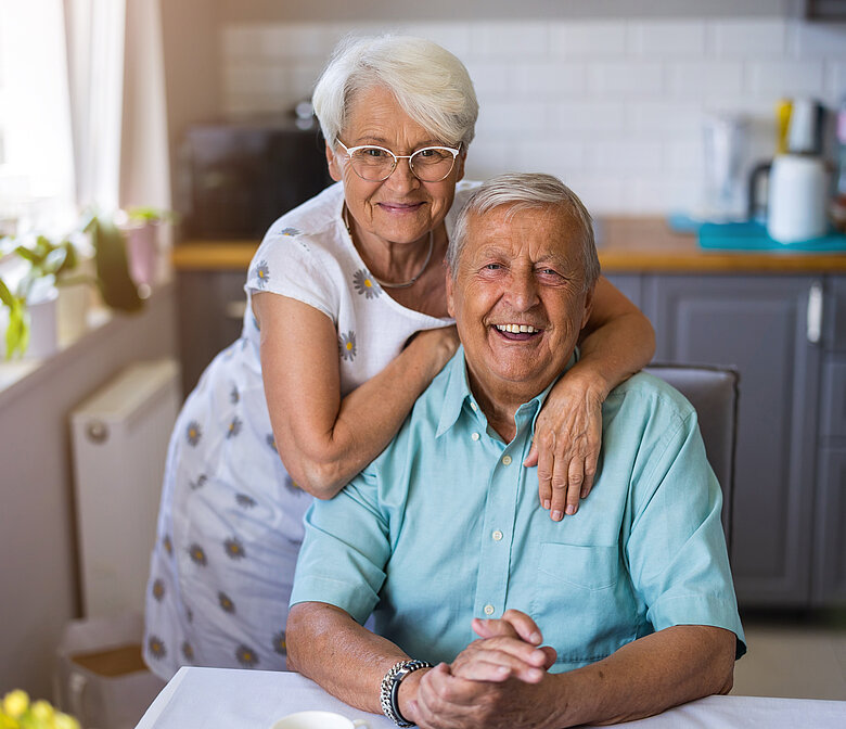 An old man and an old woman laughing