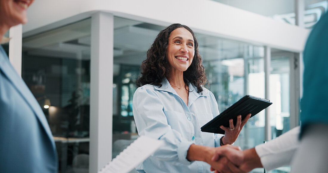 Women with Tablet shaking hand